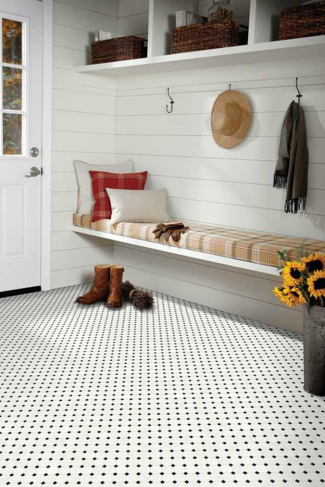 black and white penny tile in farmhouse style entryway with shiplap white walls